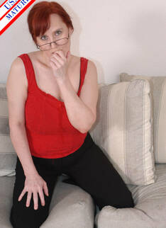 Red Mature Housewife Doing What She Does Best