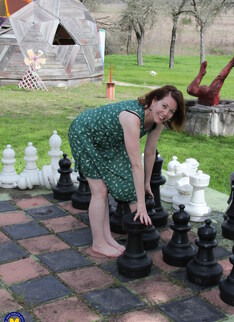 Cute mature lady playing with her pink pussy