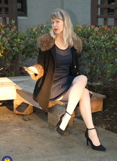 Naughty mature lady with high heels and pantyhose playing with herself
