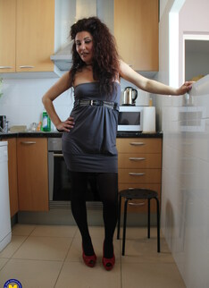 Naughty Spanish housewife playing in her kitchen