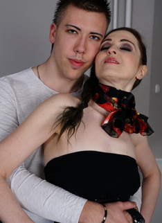 Naughty housewife playing with her toy boy