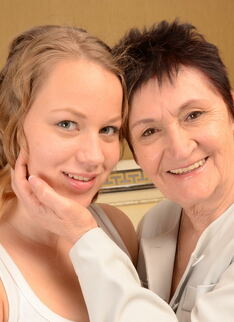 Old and young lesbian couple getting wet