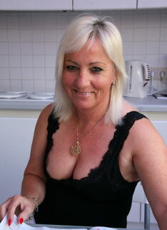 Blonde Housewife Playing With Her Pussy In The Kitchen