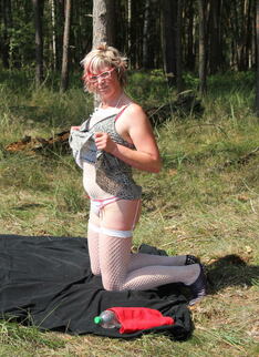 Mature Slut Playing In An Open Field With Her Pussy