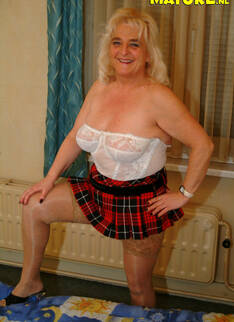 Big Titted Granny Showing Off Her Body