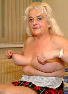 Big Titted Granny Showing Off Her Body