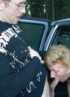 Horny Mature Slut Sucking Two Guys In The Woods