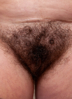 Hairy cougar playing in the shower