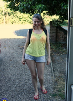 Hairy mature lady playing with the hose in the garden