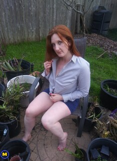 This naughty red mom loves playing with herself in the bathtub