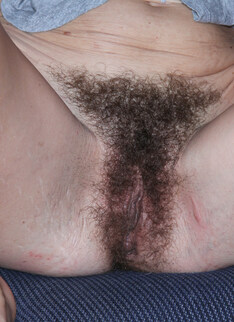 Hairy mom playing with her pussy at a public playground