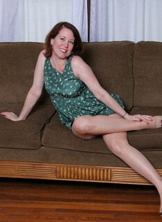 Cute mature lady playing with her pink pussy