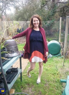 Naughty American MILF fooling around in the garden without panties