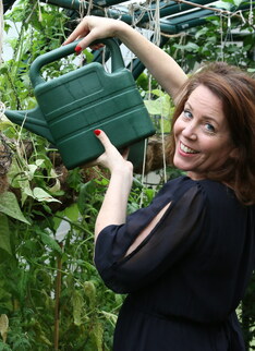 Naughty American MILF fooling around in the garden without panties
