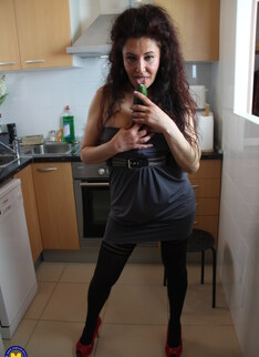 Naughty Spanish housewife playing in her kitchen