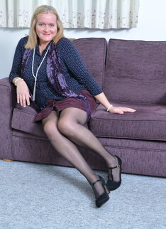 British mature lady playing on the couch