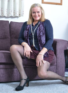 British mature lady playing on the couch