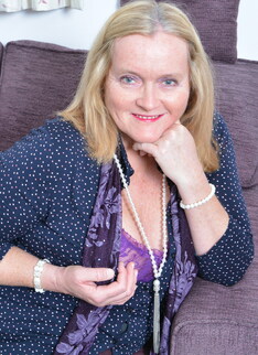 British mature lady playing on the couch
