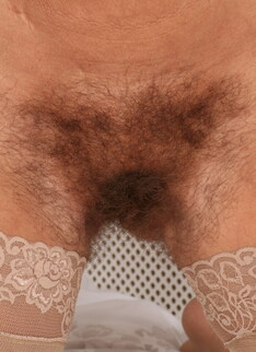 Hairy British housewife playing with her bushy pussy