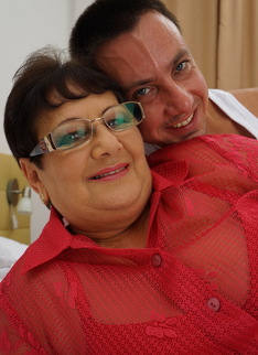 Naughty big mama playing with her toy boy