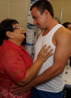 Naughty big mama playing with her toy boy