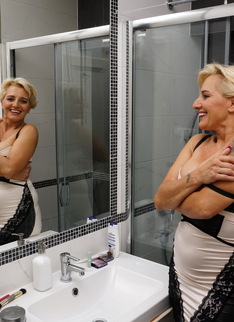 Naughty housewife getting extra wet under the shower