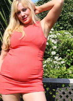 British housewife getting sun tanned in the garden