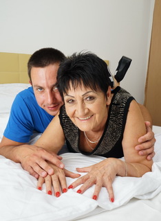 Naughty mature lady having fun with her toy boy