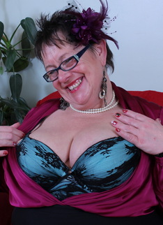 Big Breasted British mature lady fooling around