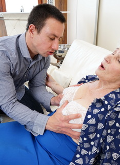 Horny toy boy playing around with a hairy granny