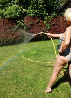 Horny blonde mature woman getting naughty in her garden