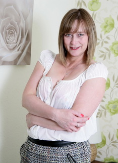 Horny British housewife playing in bed