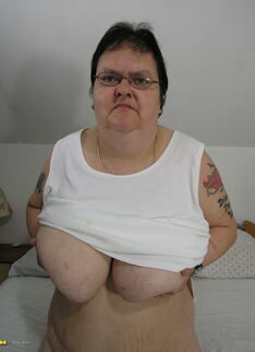 Big mama playing with her toy and tits