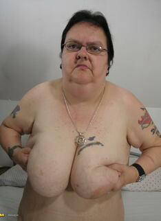 Big mama playing with her toy and tits