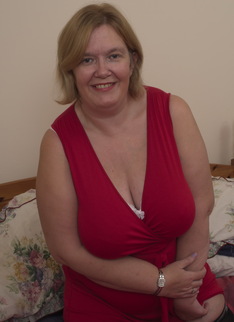 Large British mature lady with big natural tits getting dirty