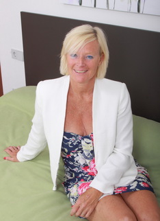 Naughty blonde housewife playing on the bed