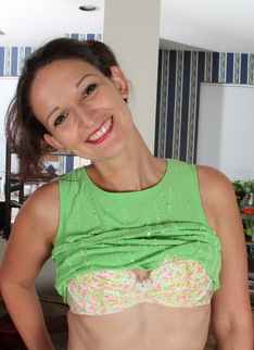 Cute American housewife stripping at home