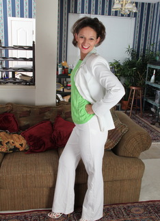 Cute American housewife stripping at home