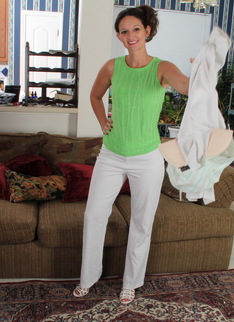 Cute American housewife stripping at home