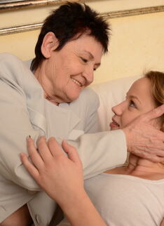 Old and young lesbian couple getting wet
